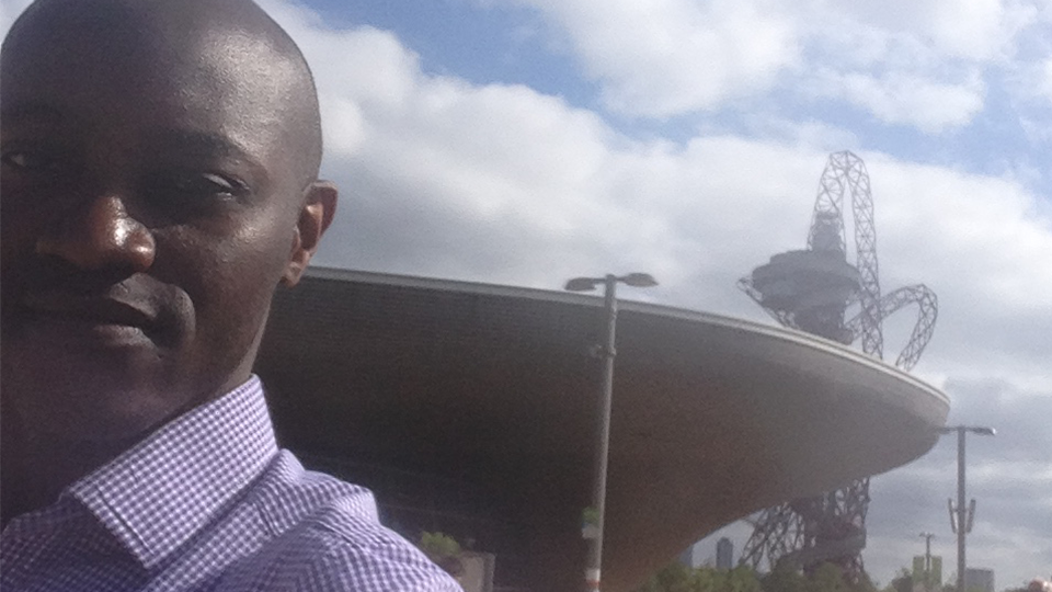 David visits the Queen Elizabeth Olympic Park and poses with the ArcelorMittal Orbit and London Aquatics Centre in the back