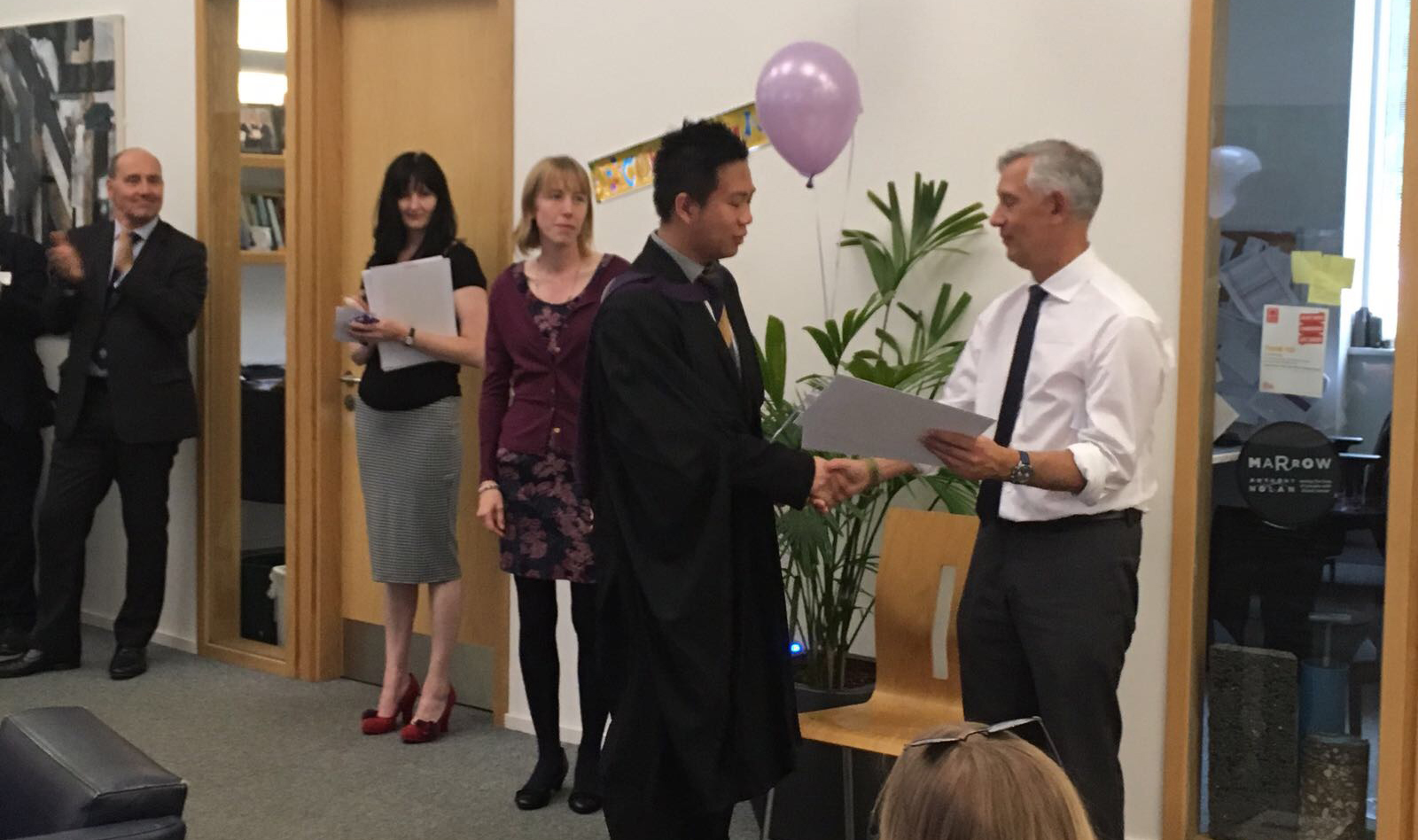 Jacky receiving his award for outstanding performance in his studies