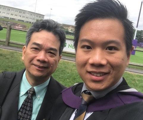 Jacky and his father on graduation day