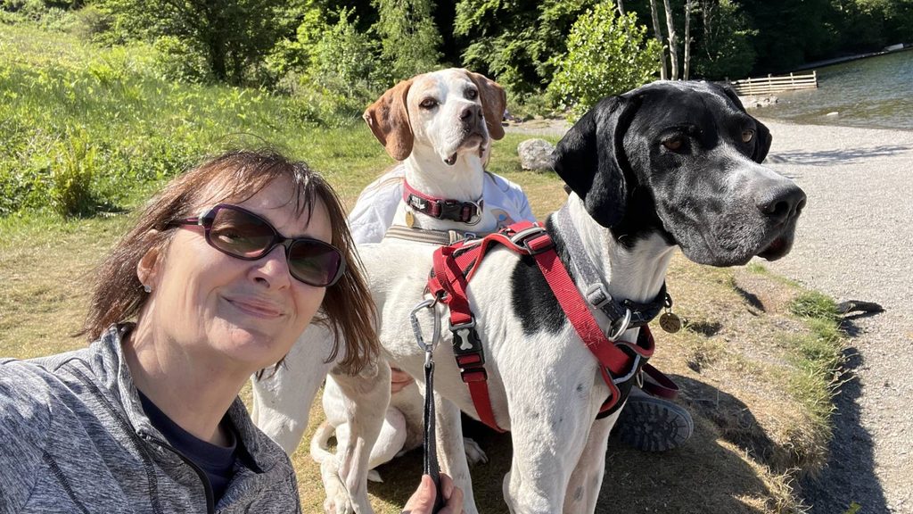 Close-up of Tina Byrom with her two dogs