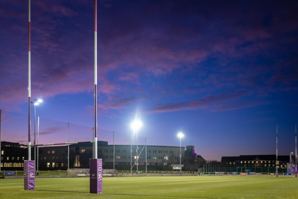 Rugby pitch at night, with floodlights on