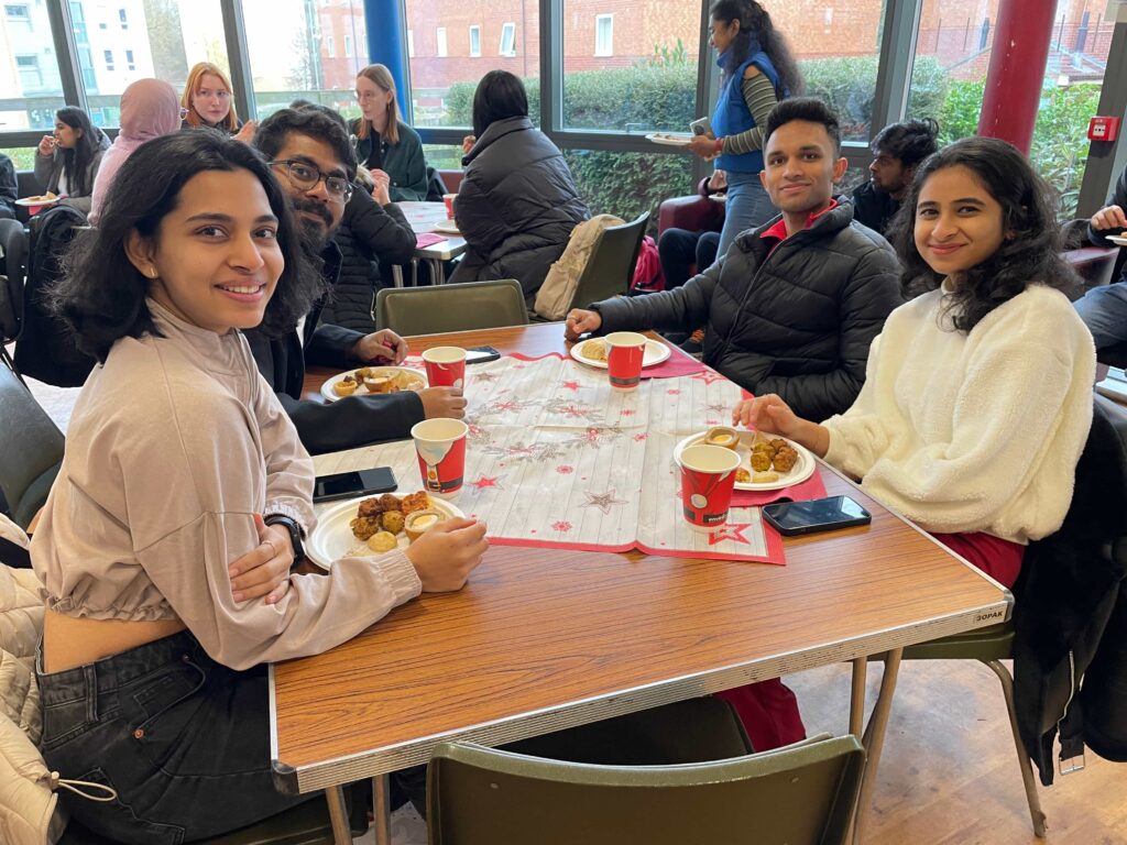 A group of students enjoying a festive lunch at Loughborough University