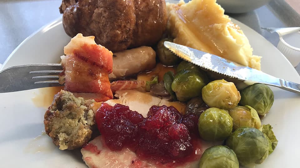 A traditional British Christmas dinner, including roast turkey, stuffing, potato and sprouts