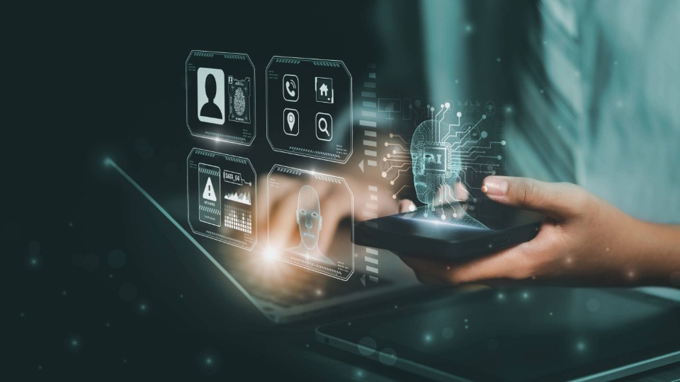 A person using their phone and laptop with a augumented reality display from both devices