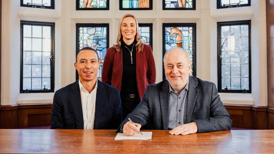 Professor Nick Jennings sat with Mark Osikoya, CEO of Commonwealth Games, with Professor Jo Maher, PVC for sport stood behind