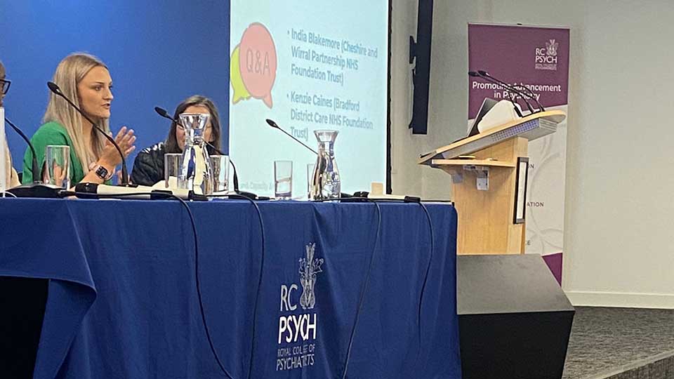 India speaking on a panel at the Royal College of Psychiatrists.